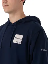 Buzo con capucha Columbia modelo Beaumount Hoodie, color azul marino, con bolsillo canguro frontal y etiqueta cuadrada con el logo de Columbia en el pecho.