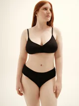 Soutien blanco de lycra con breteles finos y copa soft sin aro.