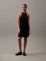 Vestido corto negro de lyocell con textura de canalé, corte recto y tirantes finos con espalda racerback.