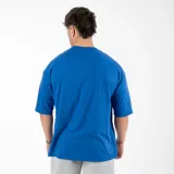 Remera negra de algodón, corte oversize y mangas cortas. Estampado frontal pequeño con la palabra 'GAINS.' en color blanco.