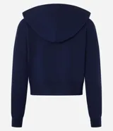 Campera corta de mujer con capucha ajustable con cordón, cierre frontal de cremallera y puños y bajo ajustados. Confeccionada en tejido de punto.