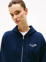 Buzo azul marino con capucha y cremallera frontal, con logo Tommy Hilfiger bordado en el pecho y en el puño.