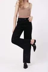 Pantalón de jean negro de corte wide leg con apliques de strass plateados.