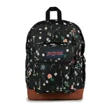 Mochila JanSport modelo Cool Student, color negro con estampado floral en tonos blanco, rosa pálido y verde. Base y ribetes de cuero sintético marrón. Cuenta con dos compartimentos principales, bolsillo frontal con organizador, bolsillo lateral para botella y funda interna para laptop.