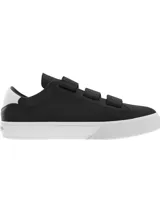 Zapatillas Tommy Jeans negras de piel con suela cupsole blanca, cierre de tres tiras de velcro y panel blanco a contraste en el talón.