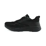 Zapatillas deportivas acordonadas color beige con detalles en negro y suela blanca.