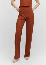 Pantalón wideleg de punto, de tiro alto y cierre lateral, con diseño largo y tejido circular.