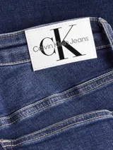 Jean skinny de tiro alto Calvin Klein, confeccionado en denim elástico azul oscuro.