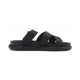 Sandalias negras con plataforma baja, tiras anchas y ajuste con velcro en el tobillo.