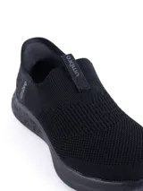 Championes slip-on Umbro Flex Lady, color negro, con capellada de tejido de punto y suela de goma.