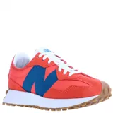 Championes New Balance 327 de mujer, color naranja con logo "N" azul, detalles en gamuza y suela de goma marrón.