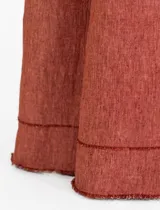 Pantalón de lino color amarillo, de corte palazzo y tiro alto.