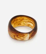 Pulsera rígida color marrón con efecto de manchas en resina.