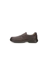 Zapato tipo mocasín slip-on para hombre, color gris oscuro o marrón oscuro, confeccionado en cuero suave. Presenta costuras visibles en contraste en color marrón claro y suela de poliuretano inyectada.