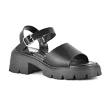 Sandalias negras de cuero sintético con plataforma y hebilla ajustable.