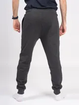 Pantalón babucha deportivo unisex azul, de tiro alto y con puños.