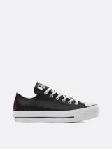 Zapatillas urbanas Converse Chuck Taylor All Star Lift, de cuero negro con plataforma blanca y cordones blancos.