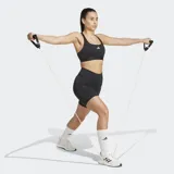 Calza corta deportiva Adidas color negro, de tiro alto y ajuste ceñido. Presenta un pequeño logo de tres barras en blanco en el muslo y un bolsillo oculto lateral.