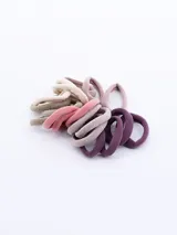 Pack de 18 gomitas de pelo elásticas de distintos colores: beige, marrón, rosa, lila y violeta.
