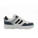 Championes blancos con detalles en gris, azul y verde.