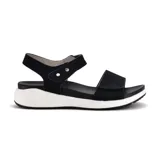 Sandalias bajas color beige con doble tira con velcro y suela blanca.