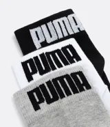 Pack de tres pares de medias cortas deportivas Puma, en color negro, blanco y gris.