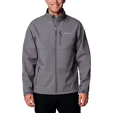 Chaqueta softshell Columbia para hombre, color gris, con cierre frontal, cuello alto, puños y dobladillo ajustables. Presenta bolsillos laterales y un bolsillo en el pecho, todos con cierre.
