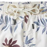 Short de baño beige con estampado de hojas y flores en tonos azul, marrón y bordó.
