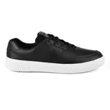 Championes negros de cuero sintético con suela blanca y cordones negros. Diseño casual y deportivo.