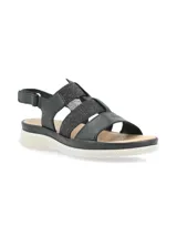 Sandalia negra con tiras de cuero y elástico con glitter, suela liviana y anatómica, tira trasera con velcro para ajuste.