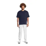 Pantalón deportivo Under Armour Unstoppable para hombre, color negro, de corte ajustado con puños elásticos en los tobillos y bolsillos laterales con cierre.