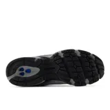 Championes New Balance 509 grises con detalles en negro, confeccionados en gamuza y malla, con logo "N" característico en los laterales y tecnología ABZORB en la entresuela.