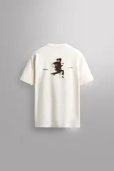 Camiseta relaxed fit color blanco confeccionada en tejido de algodón. Cuello redondo y manga corta. Estampaciones combinadas a contraste en delantero y espalda. Zara Athleticz.