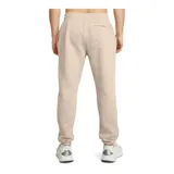 Pantalón de jogging Under Armour color beige, de corte holgado, con cintura elástica ajustable con cordón y puños acanalados.