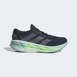 Championes de running Adidas Adistar 4, color azul oscuro con tres franjas grises en el lateral. La mediasuela es gruesa y presenta un degradado de color blanco a verde lima fluorescente, con la inscripción "REPETITOR".