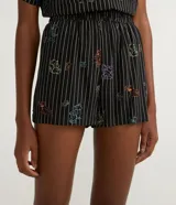 Short negro con rayas verticales blancas y estampado de Tom y Jerry en colores.