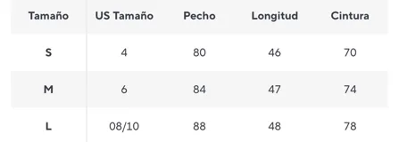 Top halter con estampado de camuflaje militar cubierto de lentejuelas brillantes. Tiene cuello y sisas ribeteadas en verde oliva.