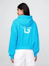 Canguro celeste con capucha y logo Gap 1969 estampado en blanco en la espalda.