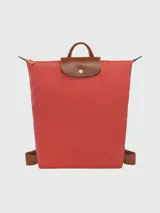 Mochila Longchamp modelo Le Pliage Original M, color crudo con detalles en cuero marrón.