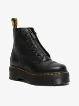Botas Dr. Martens modelo Sinclair, color negro con textura granulada, plataforma Quad, cierre frontal con cremallera y cordones.