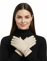 Guantes de tejido suave color azul marino, con un bordado minimalista en hilo claro en el dorso de la mano.