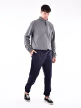 Pantalón de jogging azul oscuro con cintura elástica y cordón ajustable.