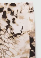 Pantalón de corte amplio con estampado abstracto en tonos beige y negro.