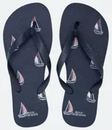 Ojotas negras con estampado de barcos a vela en blanco y rojo.