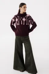 Pantalón de pana verde oliva, de corte wide leg y tiro alto.