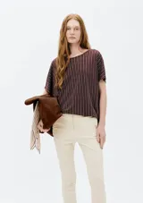 Blusa de viscosa con estampado de cebra en blanco y negro, de corte holgado y mangas cortas.