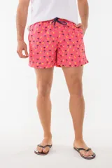 Short de baño azul con estampado de hojas de palmera en tonos azules, blancos y rosados.