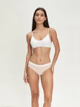 Pack de tres colaless de algodón en color gris con cintura elástica blanca.