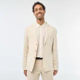 Blazer color beige de lino, corte slim, con solapa de muesca, cierre de dos botones, bolsillo en el pecho y bolsillos delanteros con solapa.