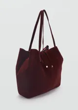 Bolso shopper grande de piel serraje color marrón, con doble asa de hombro y cierre de lazo.